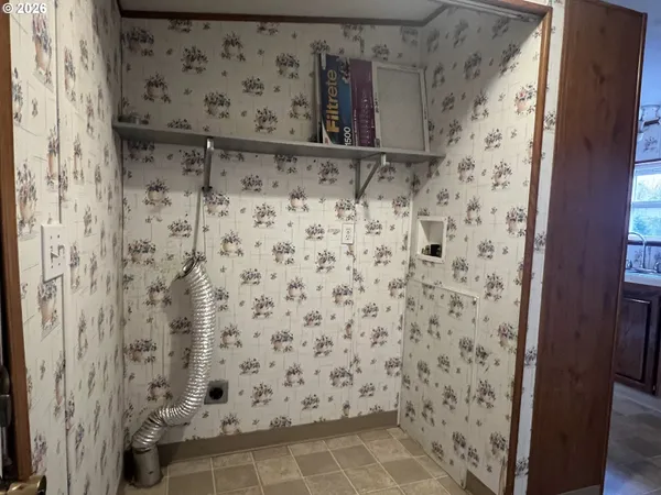 a bathroom with a shower and a sink