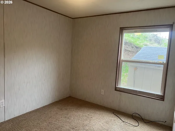a view of an empty room with a window