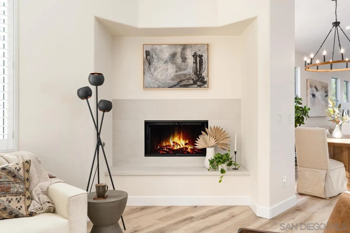 6027 Dassia Way Oceanside, CA 92056 - Photo 16 of 45 a living room with furniture and a fireplace