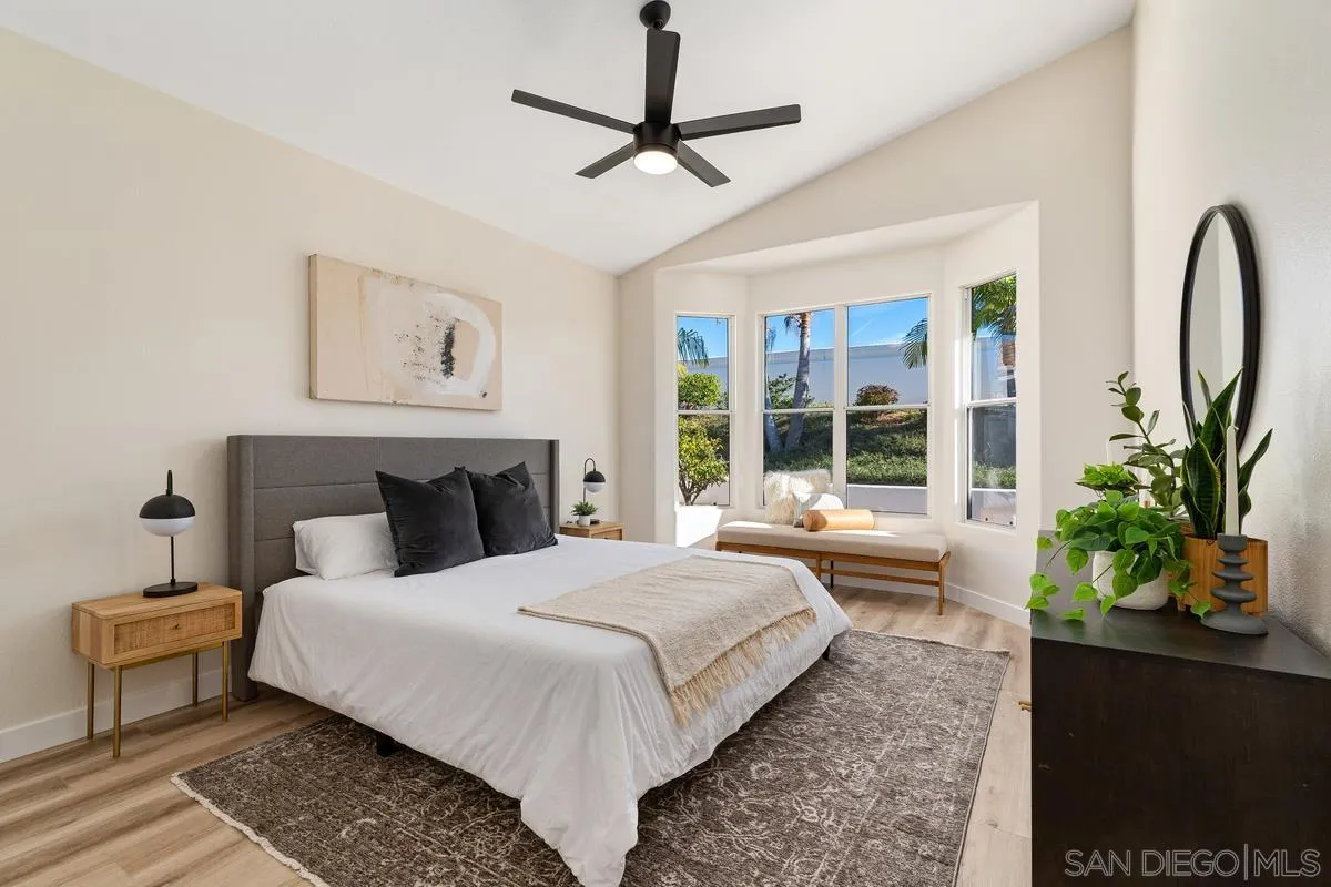 6027 Dassia Way Oceanside, CA 92056 - Photo 20 of 45 a bedroom with bed and a window