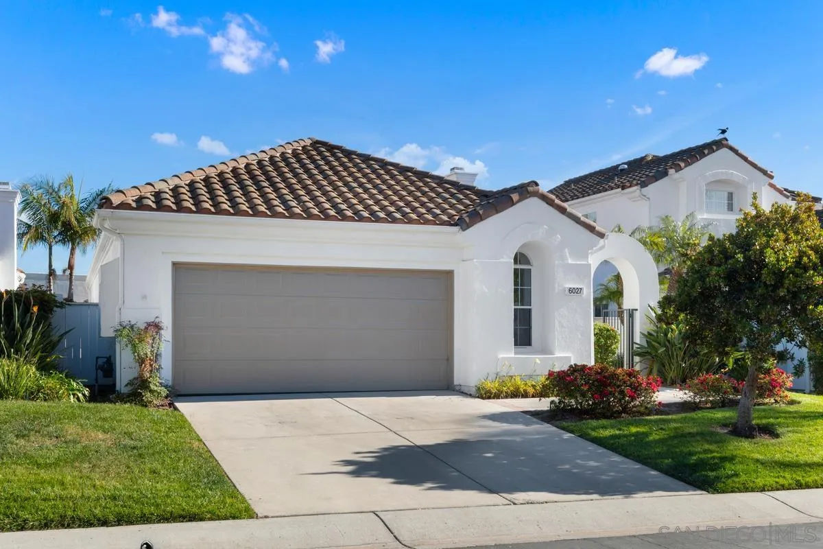 6027 Dassia Way Oceanside, CA 92056 - Photo 2 of 45 a front view of a house with a garden