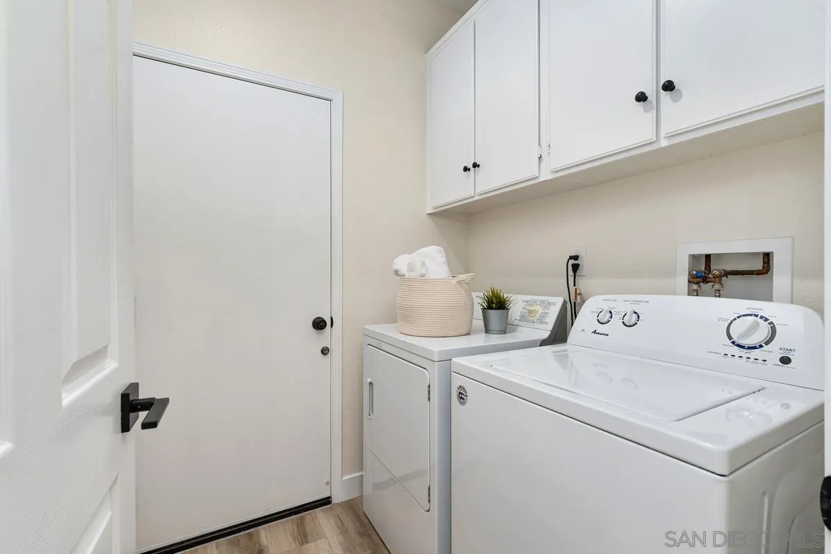 6027 Dassia Way Oceanside, CA 92056 - Photo 28 of 45 a utility room with dryer and washer