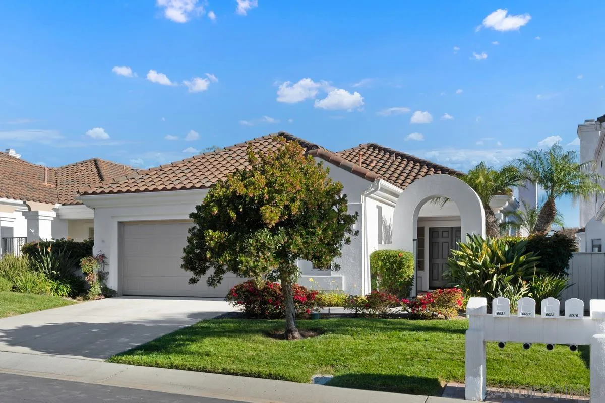 6027 Dassia Way Oceanside, CA 92056 - Photo 3 of 45 a front view of a house with a garden