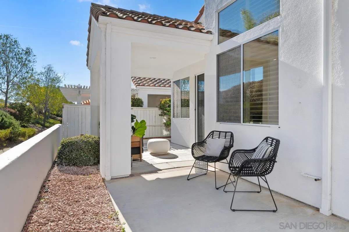 6027 Dassia Way Oceanside, CA 92056 - Photo 33 of 45 a balcony with table and chairs