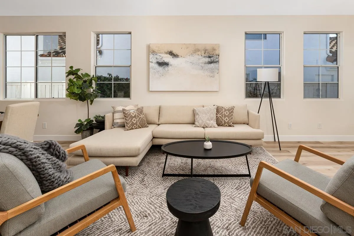 6027 Dassia Way Oceanside, CA 92056 - Photo 9 of 45 a living room with furniture and a large window