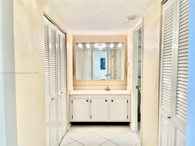 a bathroom with a bathtub and a sink
