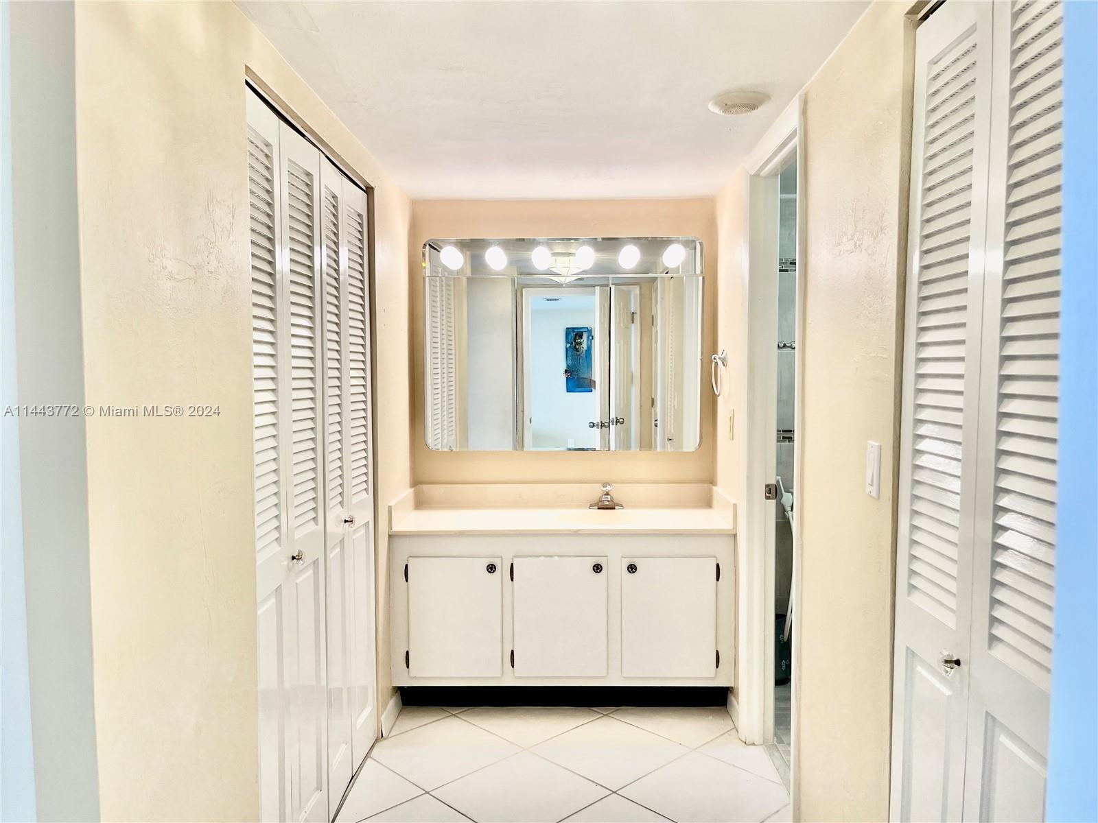 9273 Collins Avenue, Unit 507 Surfside, FL 33154 - Photo 14 of 28 a bathroom with a bathtub and a sink