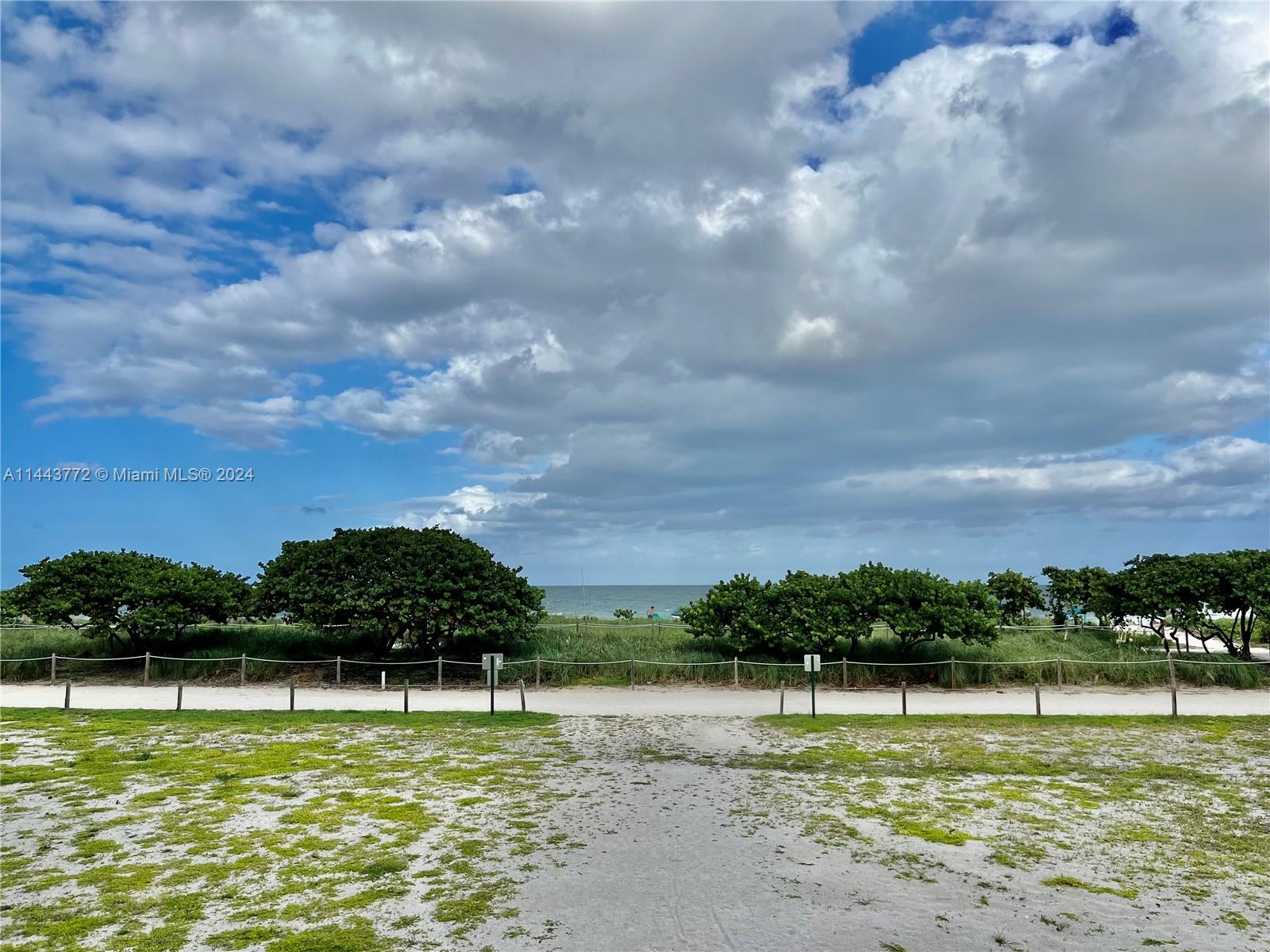 9273 Collins Avenue, Unit 507 Surfside, FL 33154 - Photo 23 of 28 a view of a lake with a yard