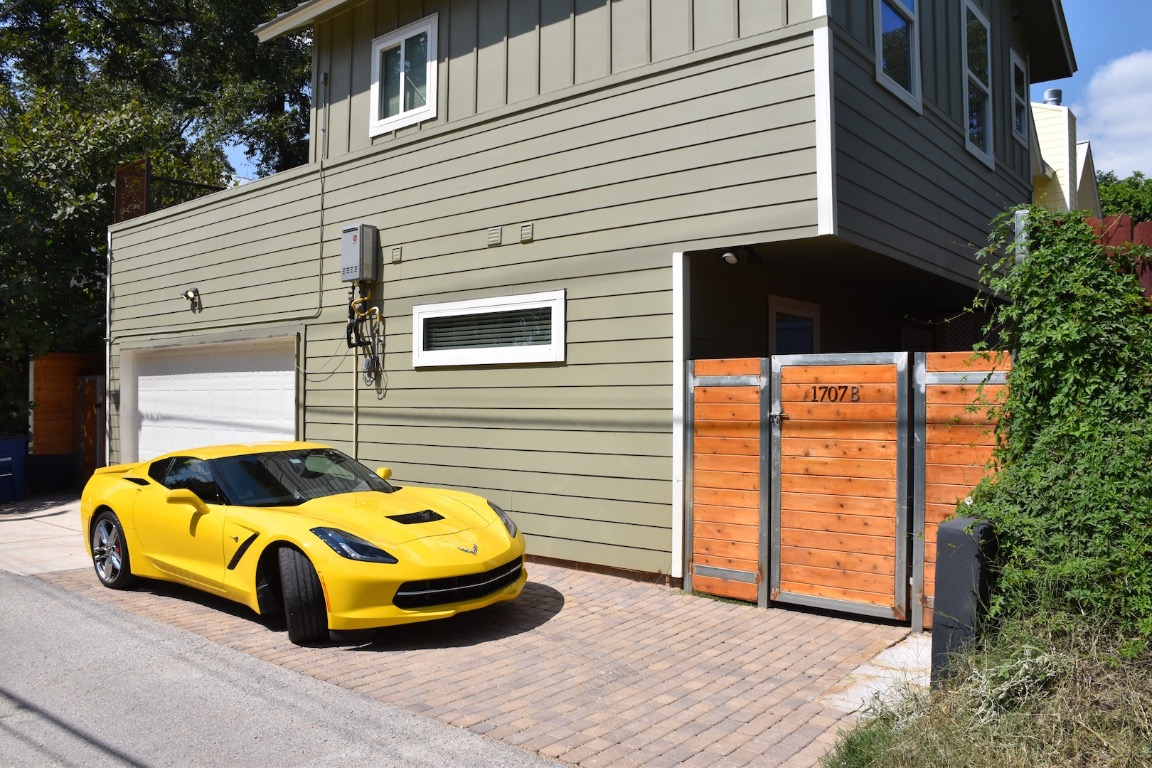 1707 Garden Street, Unit B Austin, TX 78702 - Photo 1 of 33 View of property exterior with board and batten siding and a gate