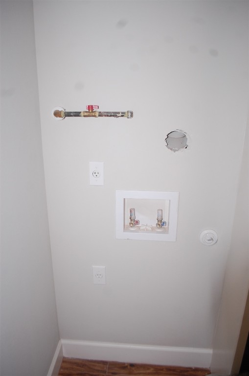 1707 Garden Street, Unit B Austin, TX 78702 - Photo 13 of 33 Washroom featuring washer hookup and dark wood finished floors
