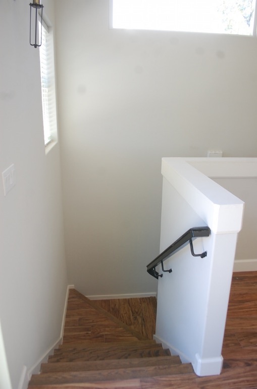 1707 Garden Street, Unit B Austin, TX 78702 - Photo 15 of 33 Stairs featuring healthy amount of natural light and wood finished floors