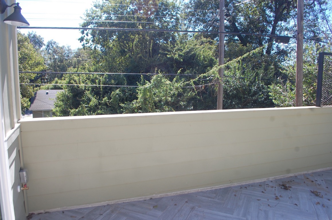 1707 Garden Street, Unit B Austin, TX 78702 - Photo 30 of 33 Balcony featuring view of scattered trees
