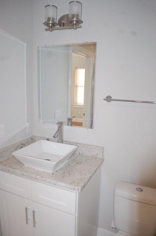 1707 Garden Street, Unit B Austin, TX 78702 - Photo 9 of 33 Bathroom with vanity and a chandelier