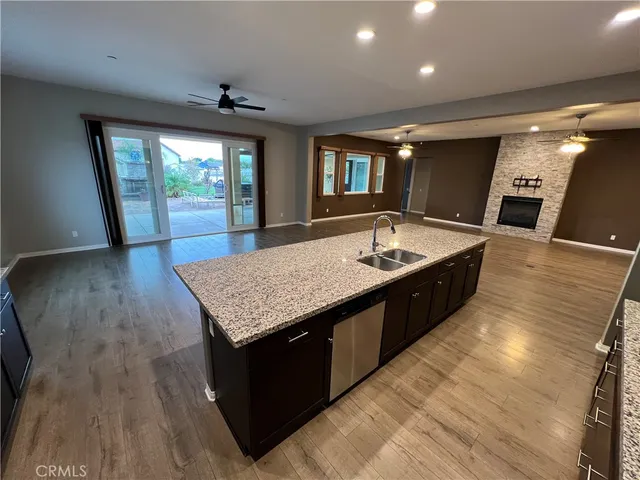 a spacious bathroom with a granite countertop sink