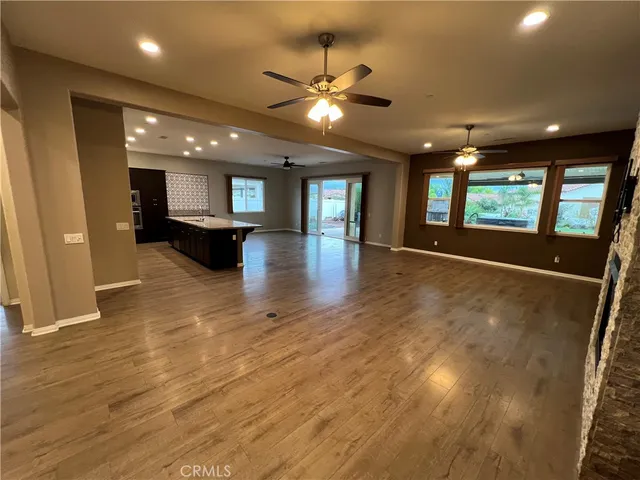 a view of livingroom and kitchen with wooden floor