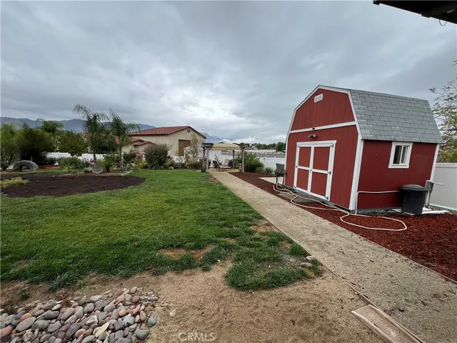 a view of an empty room with a wooden floor