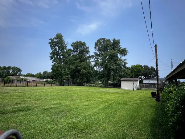a backyard of a house with lots of green space