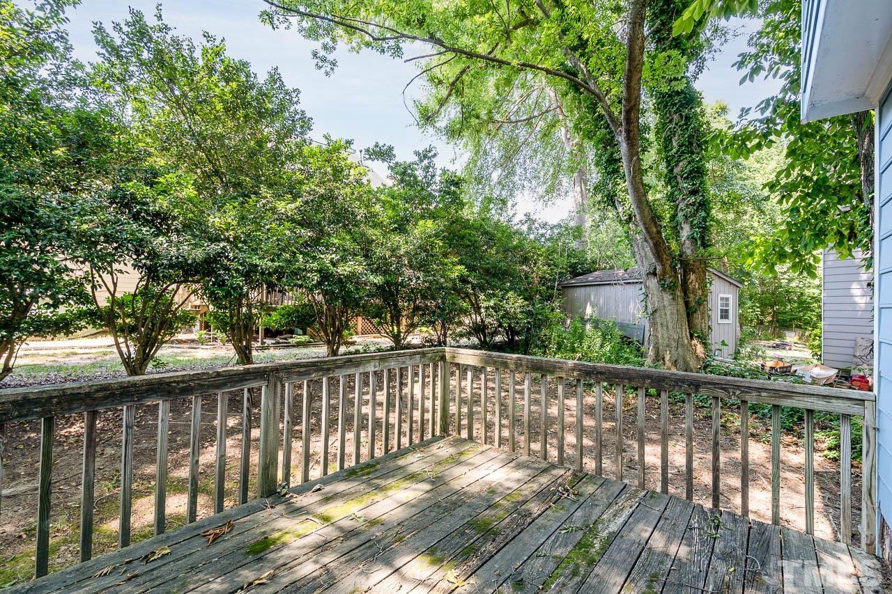 4608 Fisk Court Raleigh, NC 27604 - Photo 16 of 21 a view of a wooden fence next to a yard