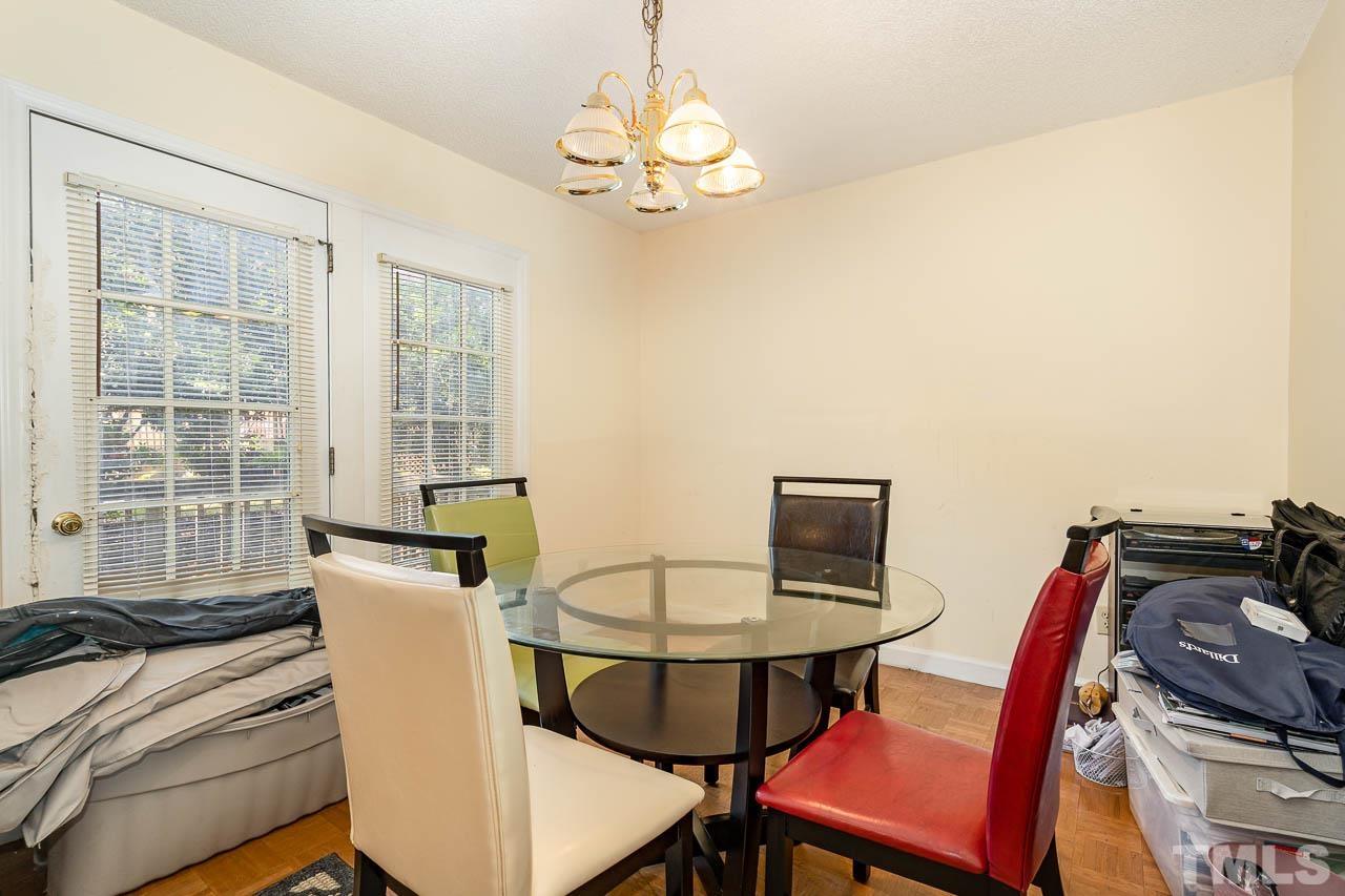 4608 Fisk Court Raleigh, NC 27604 - Photo 5 of 21 a view of a dining room with furniture and window