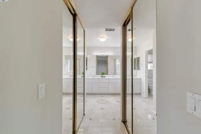 a view of a bathroom from a hallway