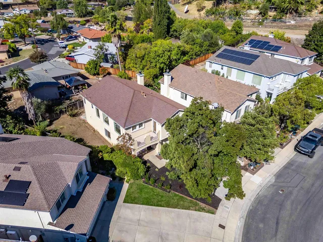 an aerial view of residential houses with outdoor space