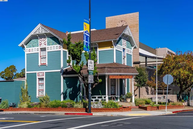 a view of a street with flower plants