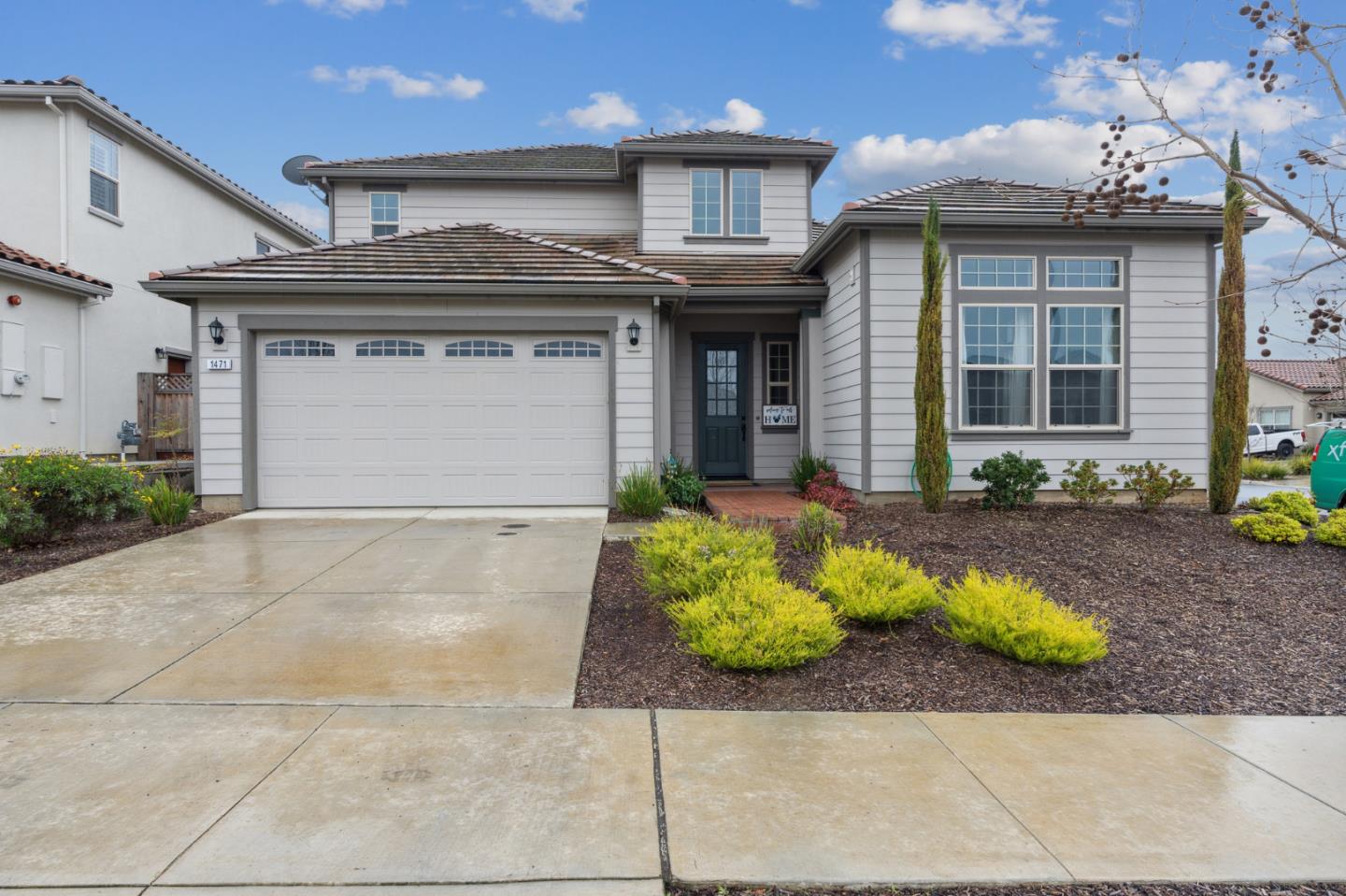 1471 Trinity Circle Hollister, CA 95023 - Photo 1 of 29 a front view of a house with garden