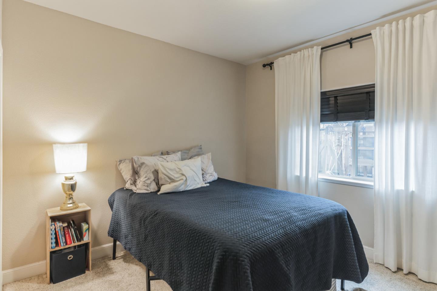 1471 Trinity Circle Hollister, CA 95023 - Photo 20 of 29 a bedroom with a bed and a window