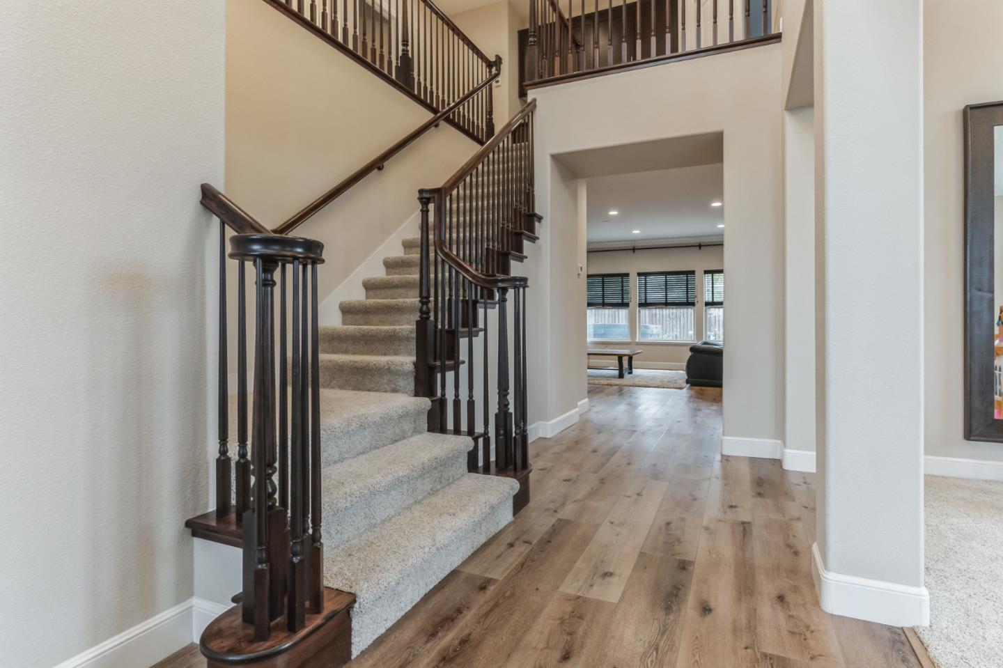 1471 Trinity Circle Hollister, CA 95023 - Photo 2 of 29 a view of a hallway with wooden floor and staircase