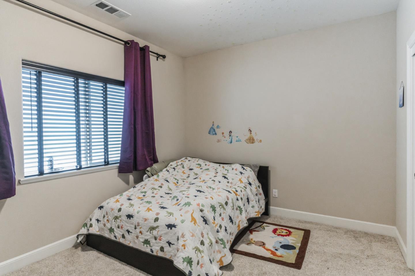 1471 Trinity Circle Hollister, CA 95023 - Photo 24 of 29 a bedroom with a bed and a window