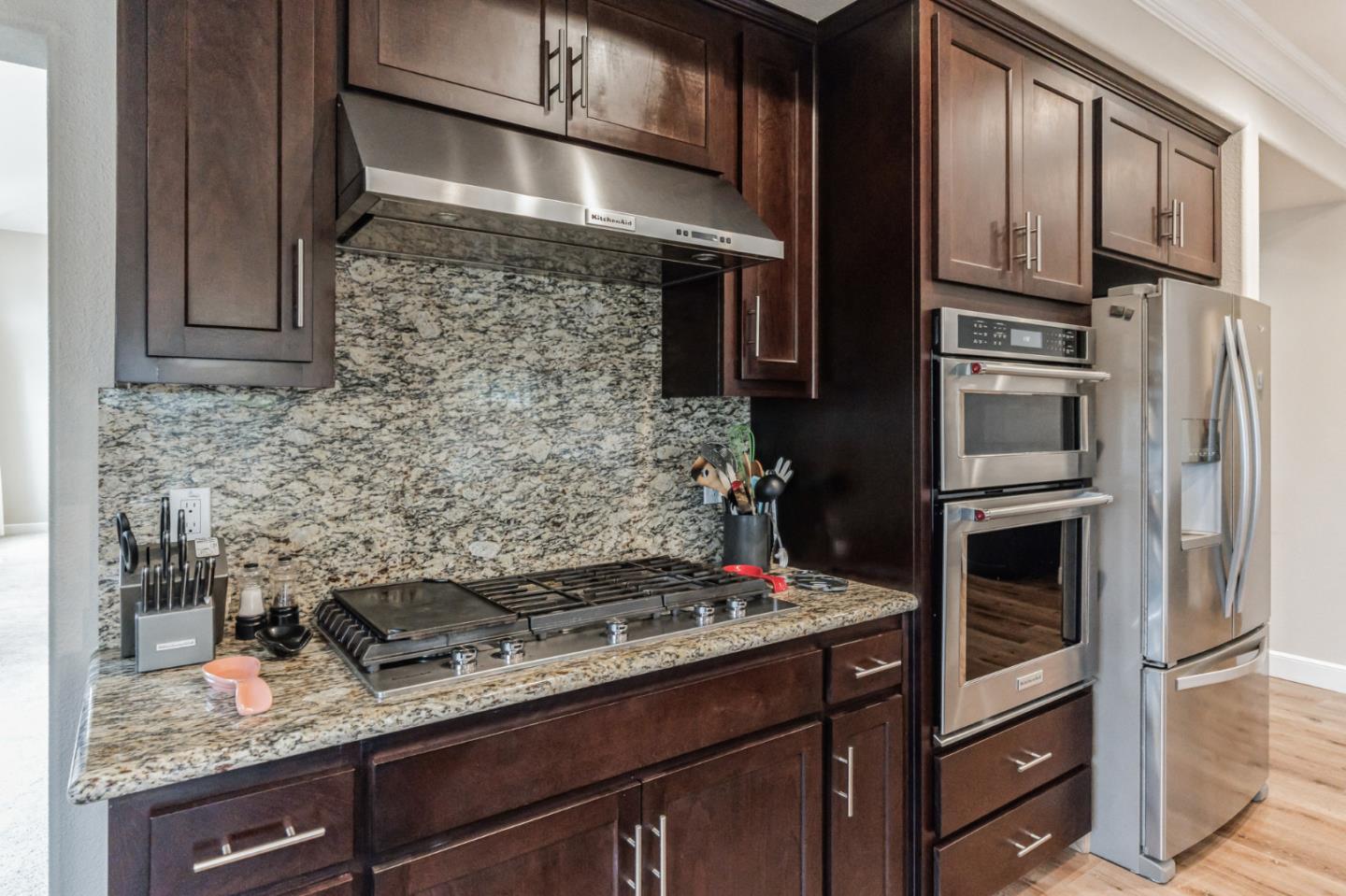 1471 Trinity Circle Hollister, CA 95023 - Photo 7 of 29 a kitchen with a stove and a refrigerator