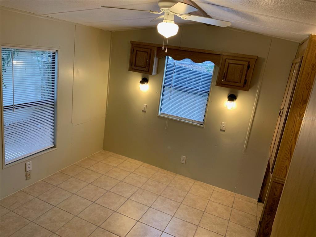 3000 Clarcona Road, Unit 723 Apopka, FL 32703 - Photo 11 of 14 a view of entryway and hall with wooden floor