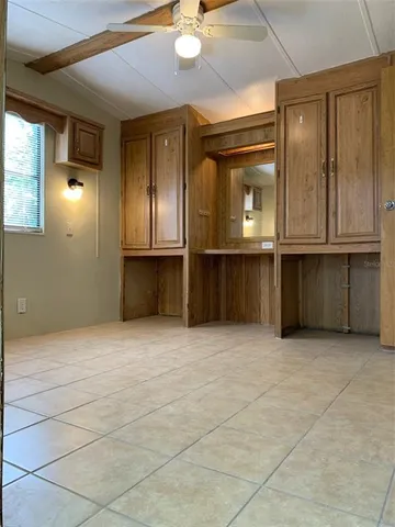 a view of kitchen with cabinets