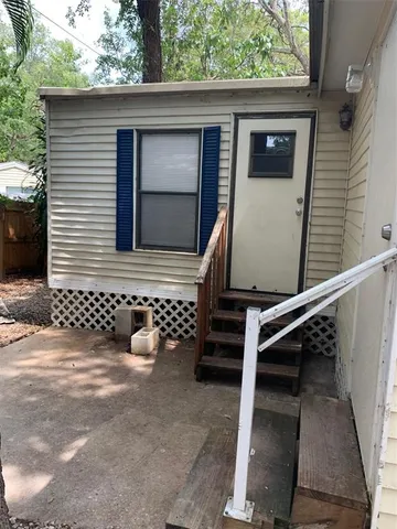 a side view of a house with a door