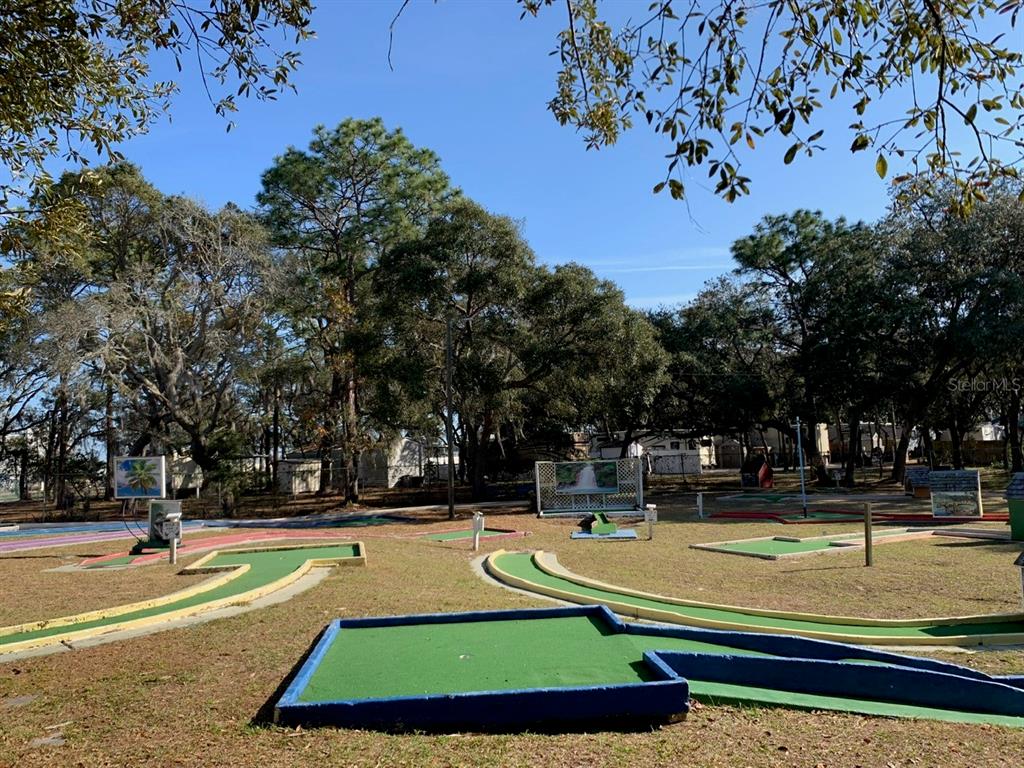 3000 Clarcona Road, Unit 723 Apopka, FL 32703 - Photo 8 of 14 a view of swimming pool with outdoor seating and trees