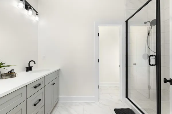 a bathroom with a sink and mirror