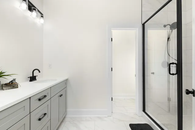 a bathroom with a sink and mirror