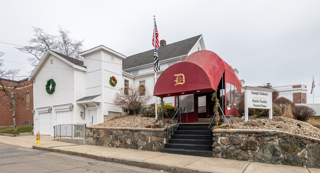a front view of a building with street view