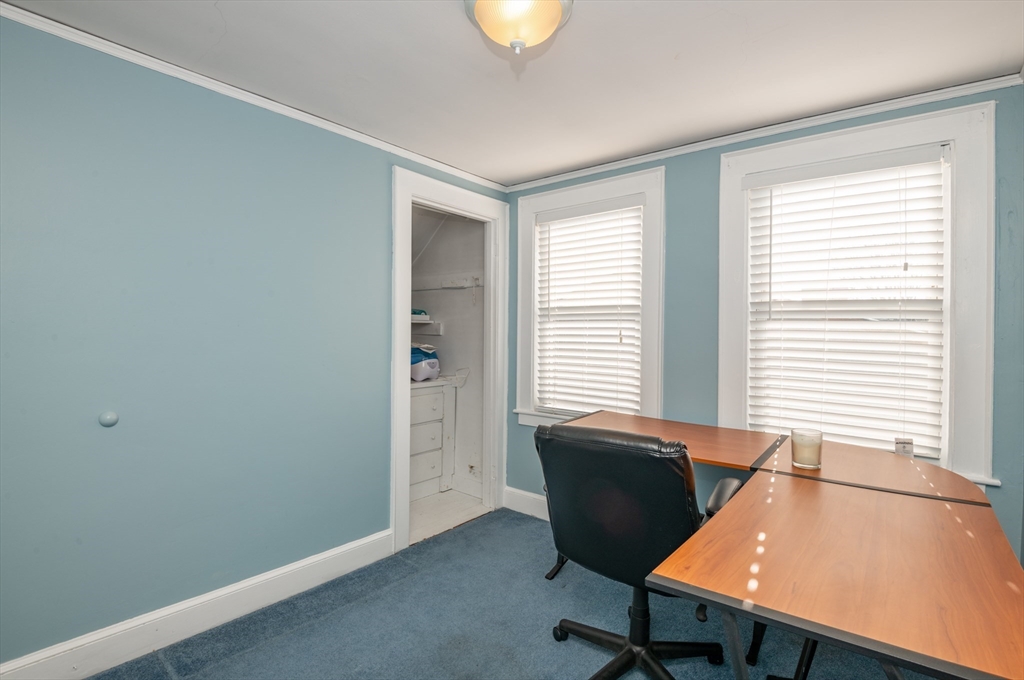 11 Linden Street Reading, MA 01867 - Photo 19 of 31 a view of a workspace with furniture and a window