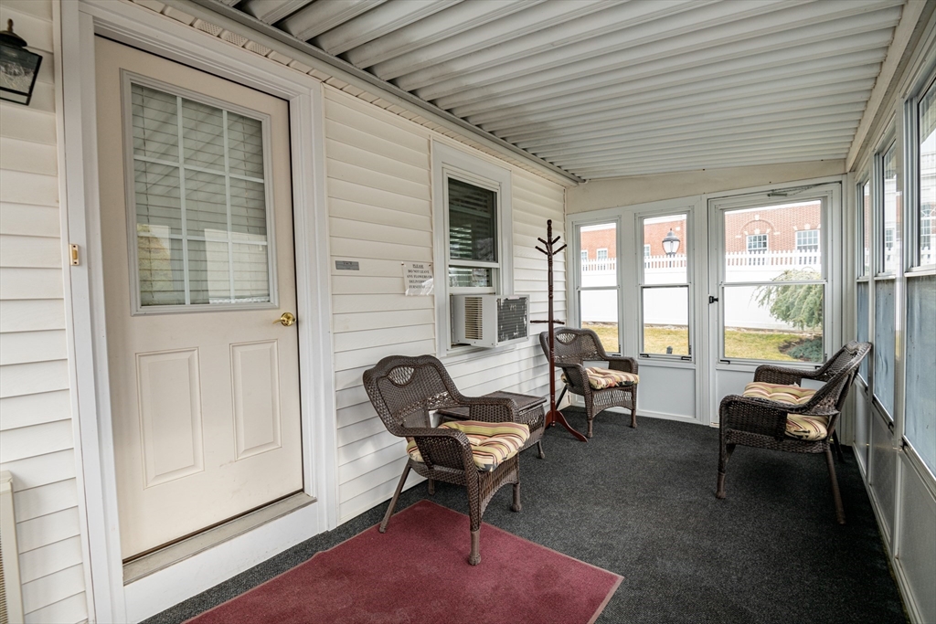11 Linden Street Reading, MA 01867 - Photo 24 of 31 a living room with furniture and a window