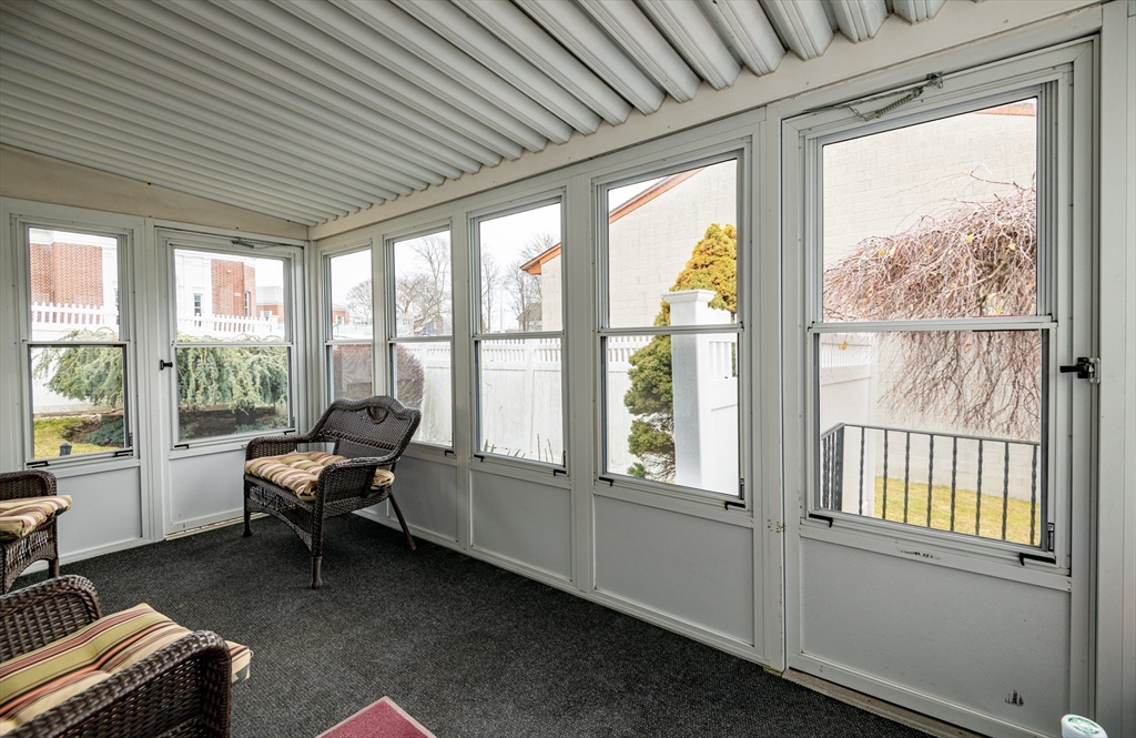 11 Linden Street Reading, MA 01867 - Photo 25 of 31 a living room with furniture and a window
