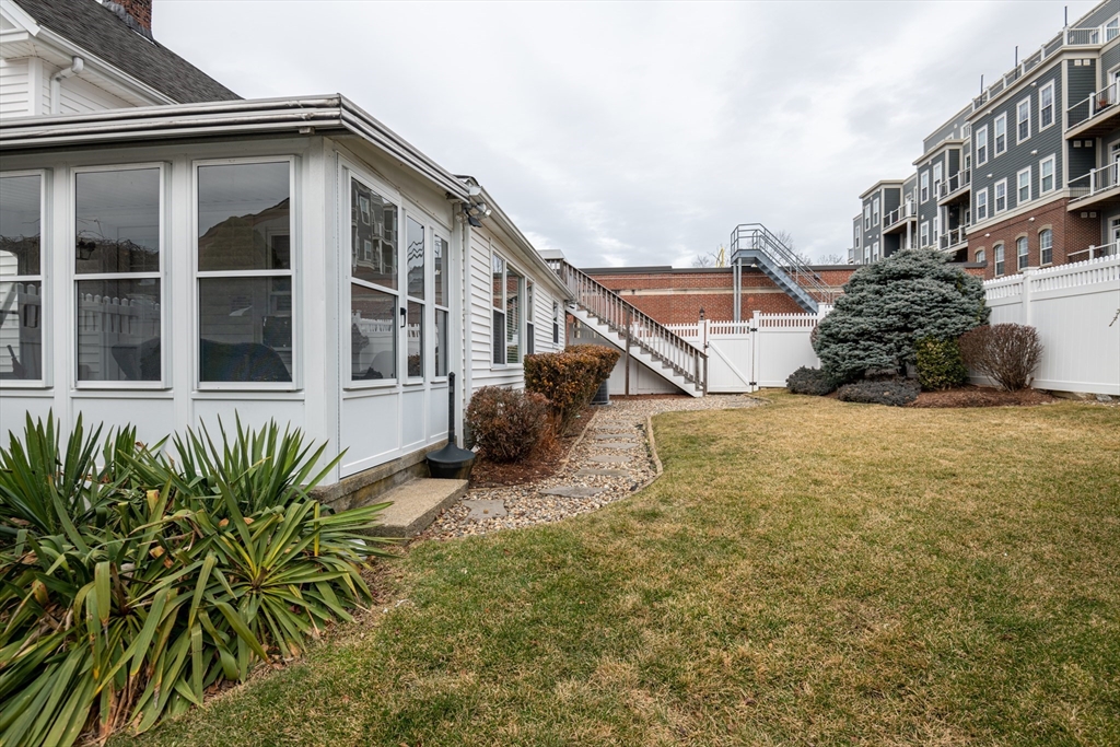 11 Linden Street Reading, MA 01867 - Photo 28 of 31 a view of a house with a small yard and plants