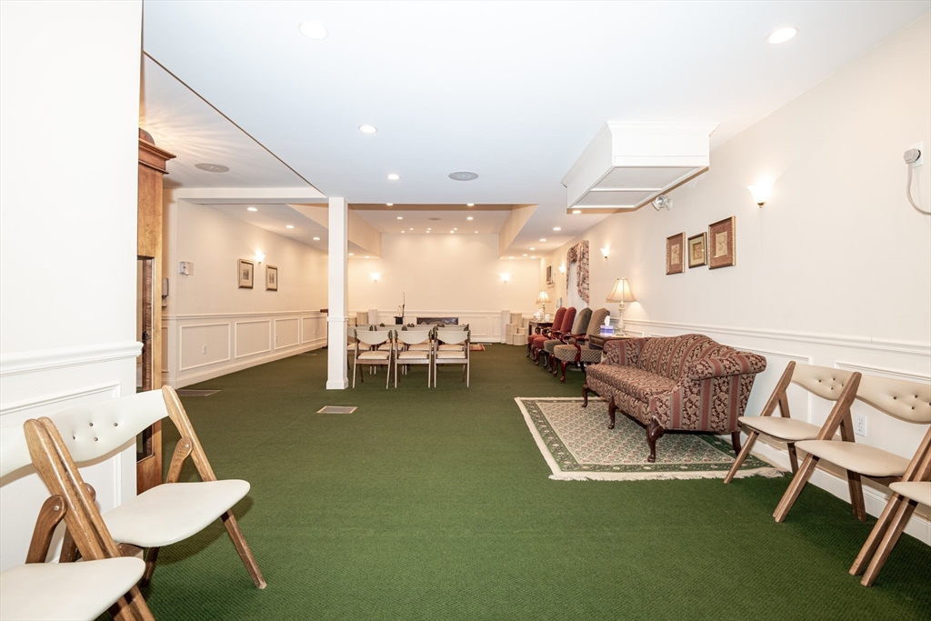 11 Linden Street Reading, MA 01867 - Photo 8 of 31 a living room with furniture and a table
