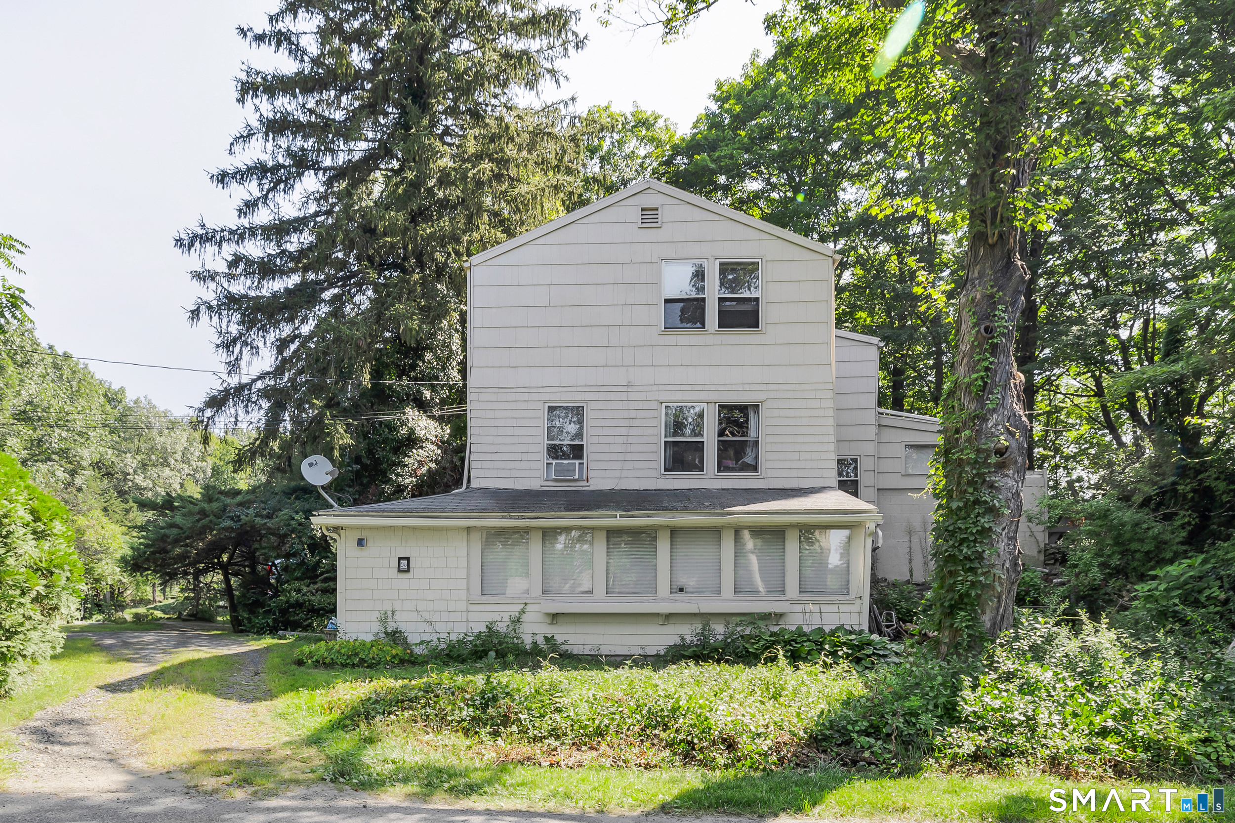 90 Rowley Road Woodbury, CT 06798 - Photo 1 of 40 a view of a house with yard and plants