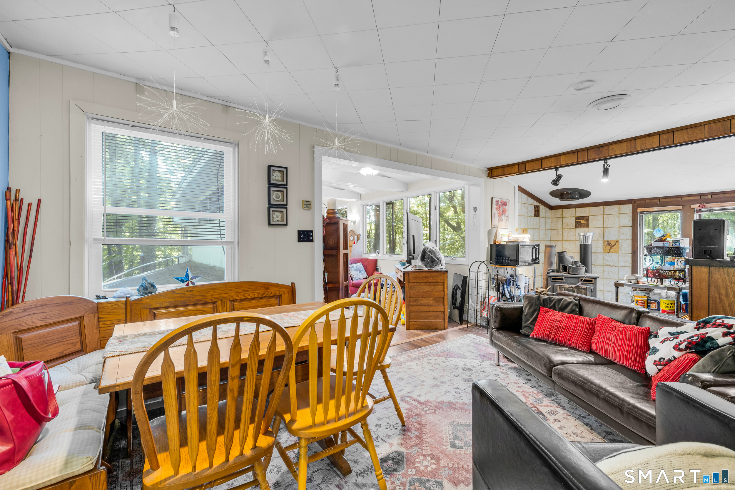 90 Rowley Road Woodbury, CT 06798 - Photo 19 of 40 a living room with furniture and a floor to ceiling window