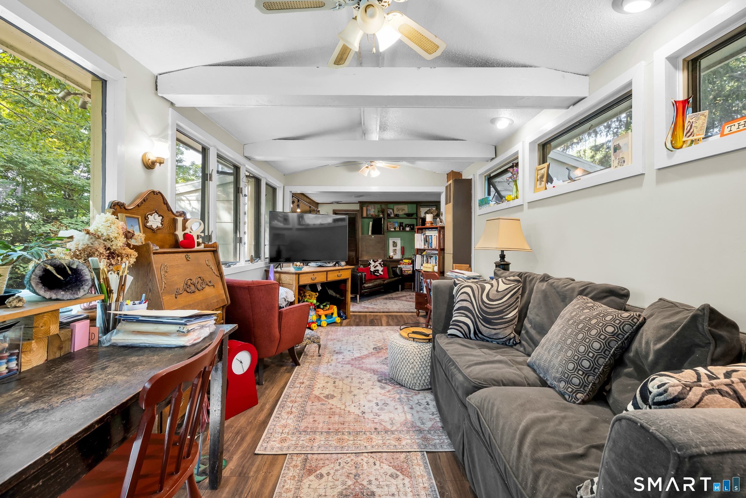 90 Rowley Road Woodbury, CT 06798 - Photo 21 of 40 a living room with furniture and a chandelier