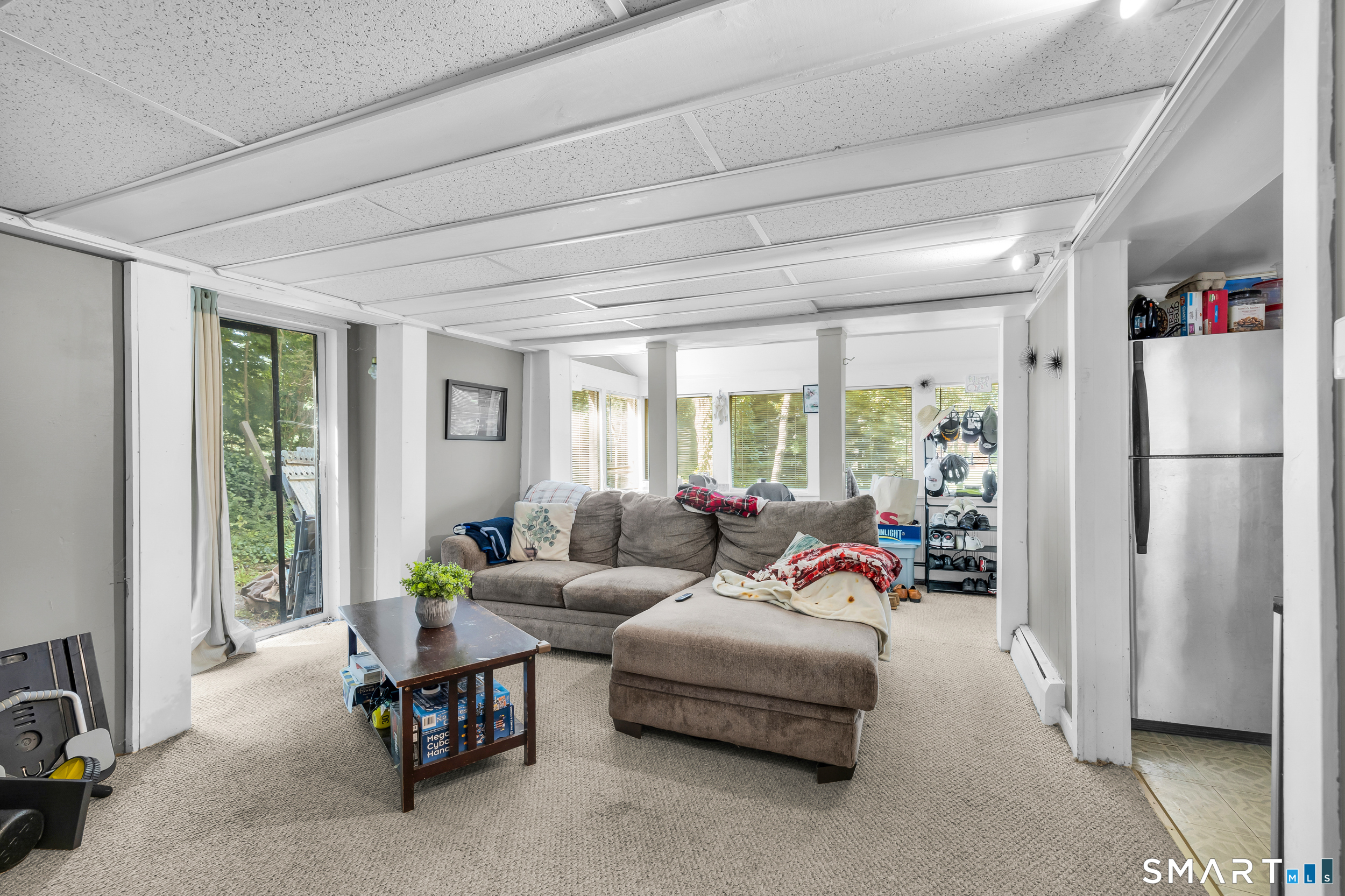 90 Rowley Road Woodbury, CT 06798 - Photo 3 of 40 a living room with furniture and a large window
