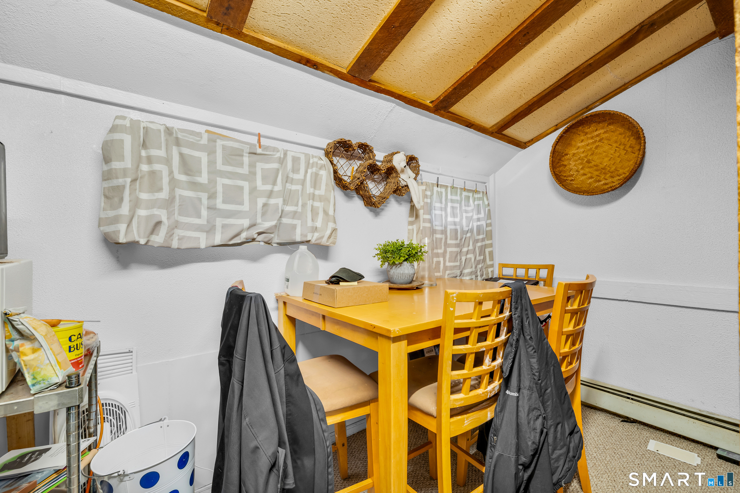90 Rowley Road Woodbury, CT 06798 - Photo 5 of 40 a view of a dining room with furniture and chandelier