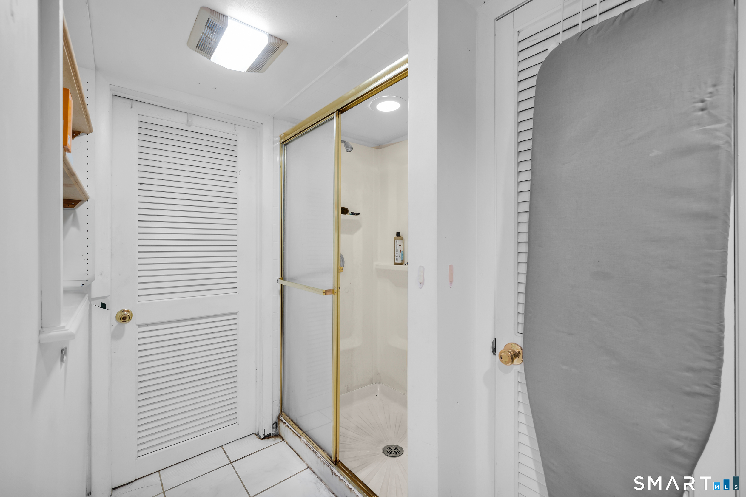 90 Rowley Road Woodbury, CT 06798 - Photo 7 of 40 a bathroom with a glass shower door