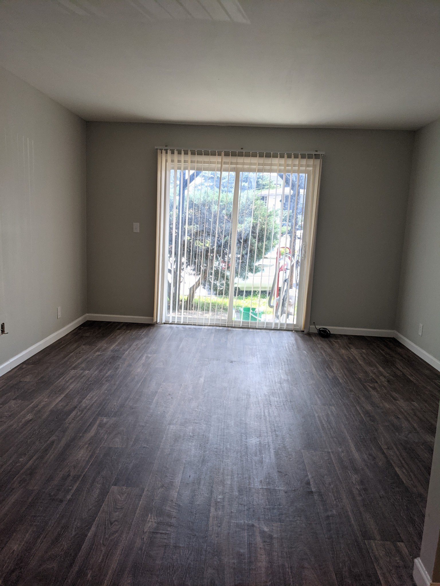 320 Welch Road, Unit F1 Nashville, TN 37211 - Photo 2 of 13 an empty room with wooden floor and windows